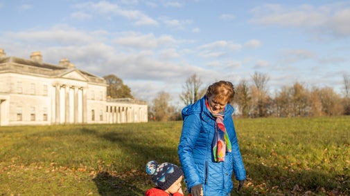 Family walking at Castle Coole in Winter